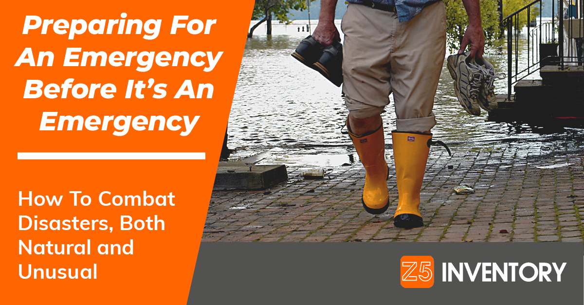 A man heads away from a flood wearing galoshes, because he's at least that prepared.