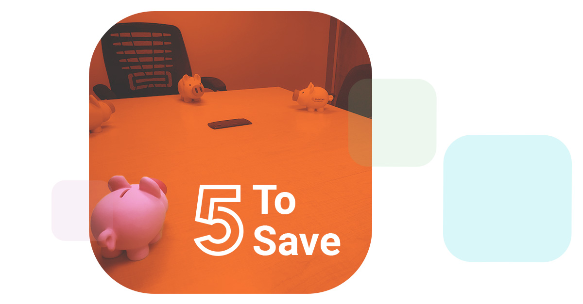 the Z5 Piggy Bank sits at the board room table with several other piggy banks next to the stenciled words 5 To Save