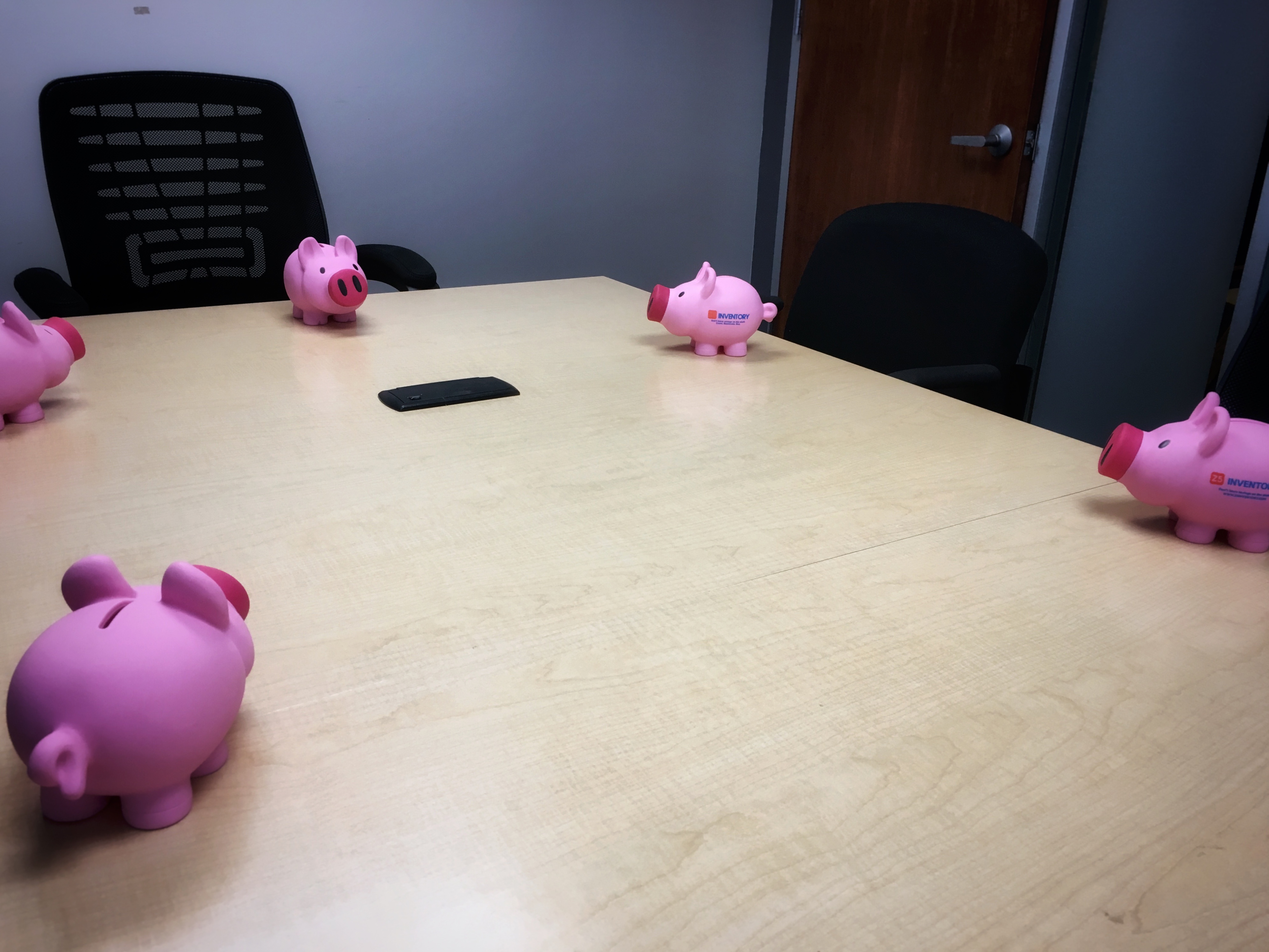 The Z5 Piggy Bank holding a boardroom meeting.