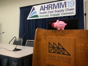 The Z5 Piggy Bank sits on the podium that presides over AHRMM19 in anticipation of the presentation "The Culture of Change."