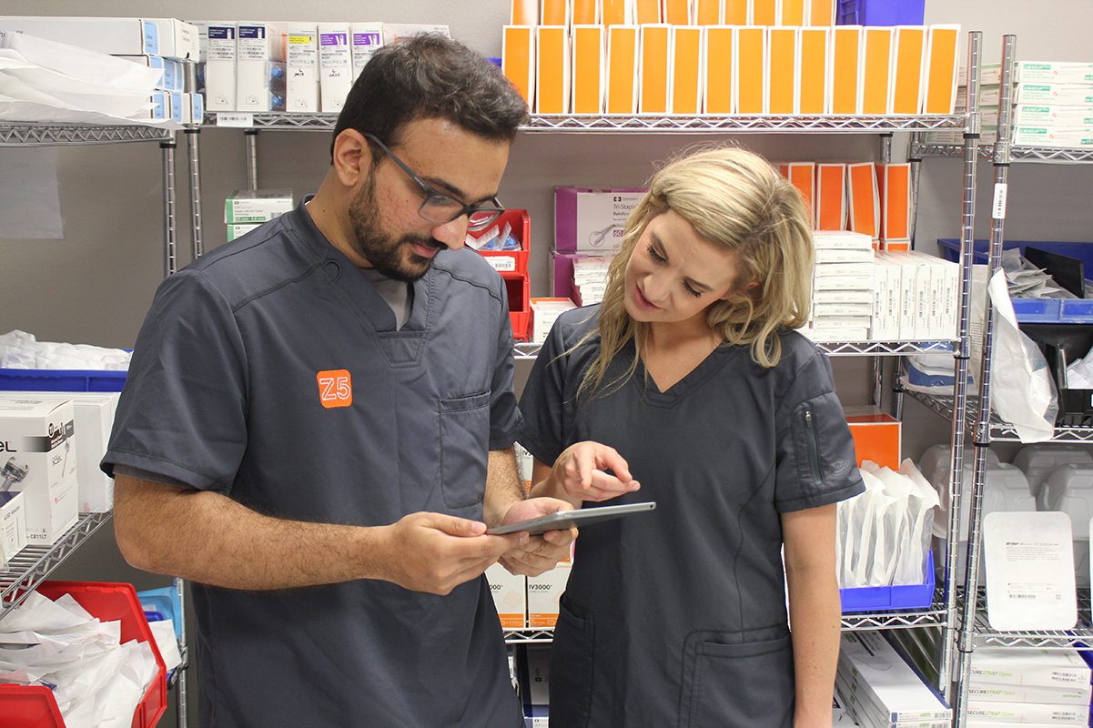 Z5 Reallocate specialists review a list of items to remove from a hospital before they expire.